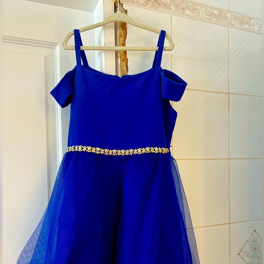 Girls hi-low dress with rhinestones. Small stain on front of dress. Worn 1 time.